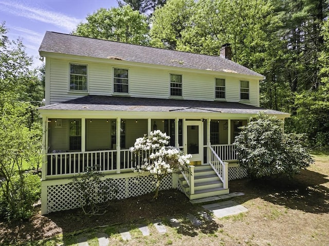 26 E St, Hopkinton, MA 01748 - view of front of home with a chimney, a porch, and a shingled roof