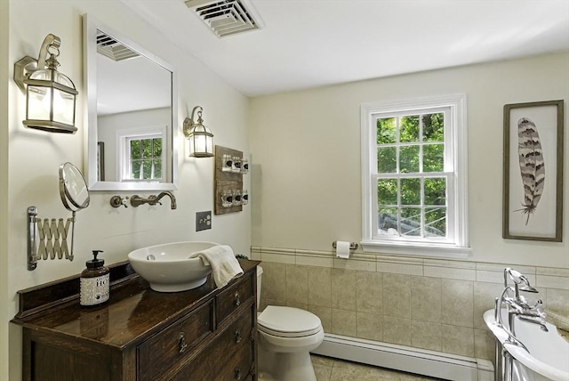 26 E St, Hopkinton, MA 01748 - bathroom with a baseboard radiator, toilet, tile patterned flooring, a wainscoted wall, and vanity