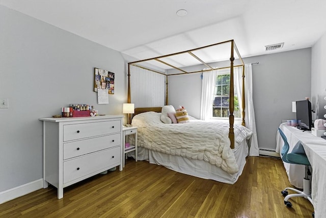 26 E St, Hopkinton, MA 01748 - bedroom featuring baseboard heating and wood finished floors