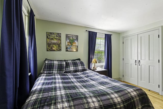 26 E St, Hopkinton, MA 01748 - bedroom with light wood-type flooring and a closet