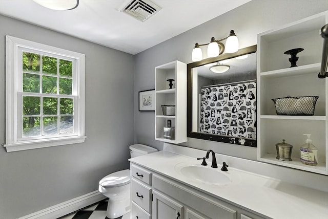 26 E St, Hopkinton, MA 01748 - full bath with toilet, vanity, a shower with curtain, baseboards, and tile patterned floors