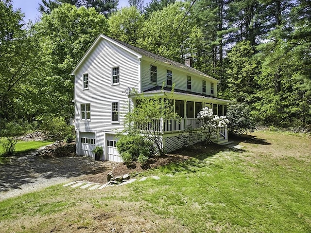 26 E St, Hopkinton, MA 01748 - view of side of home with a chimney, dirt driveway, a yard, and a garage