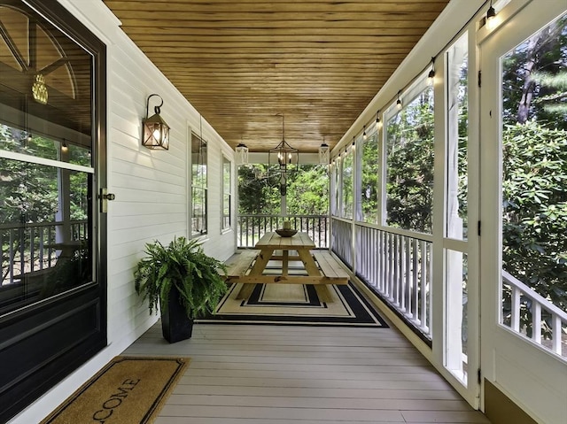 26 E St, Hopkinton, MA 01748 - unfurnished sunroom featuring wooden ceiling, plenty of natural light, and wood-type flooring