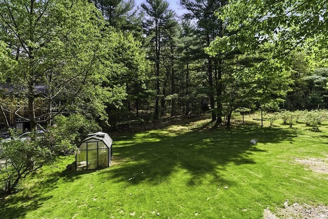 26 E St, Hopkinton, MA 01748 - view of grassy yard featuring an exterior structure and an outdoor structure