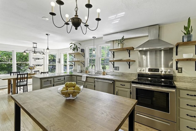 26 E St, Hopkinton, MA 01748 - kitchen featuring open shelves, stainless steel appliances, wall chimney range hood, and a chandelier