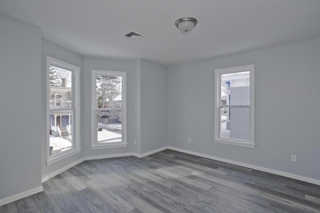 unfurnished room featuring wood-type flooring