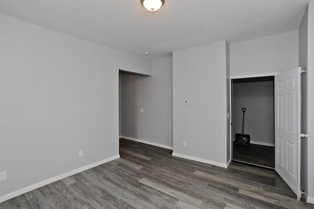 spare room featuring dark hardwood / wood-style floors