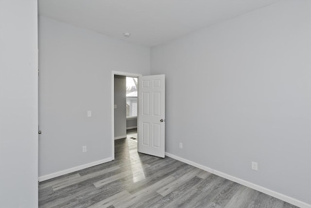 unfurnished bedroom featuring hardwood / wood-style flooring