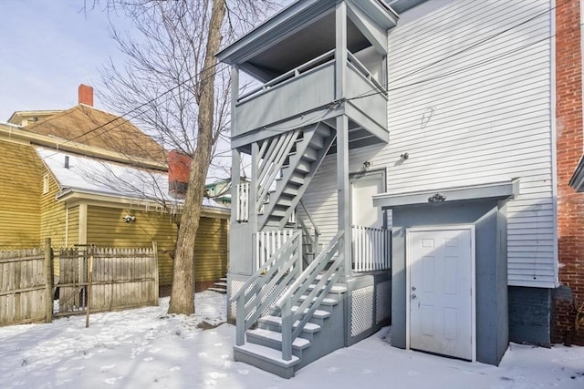 view of snow covered property entrance