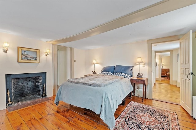 bedroom with wood-type flooring