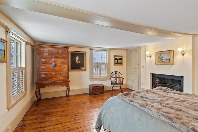 bedroom with dark hardwood / wood-style floors