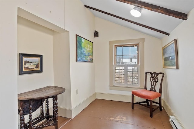 sitting room featuring baseboard heating, concrete floors, and lofted ceiling with beams