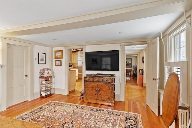 living room featuring light hardwood / wood-style flooring and radiator