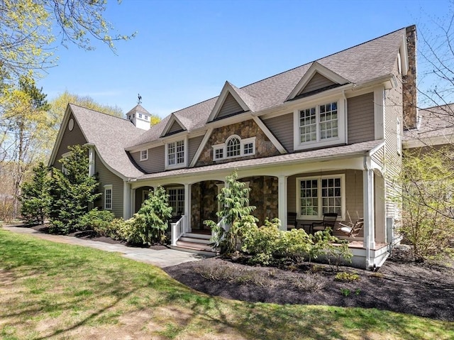 33 Old Concord Rd, Lincoln, MA 01773 - view of front of house with a shingled roof, a porch, and stone siding