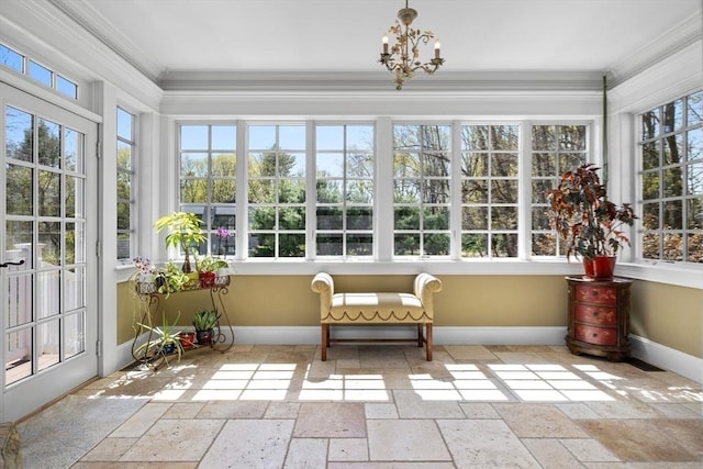 33 Old Concord Rd, Lincoln, MA 01773 - sunroom / solarium with an inviting chandelier, baseboards, ornamental molding, and stone tile flooring