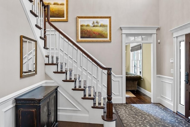 33 Old Concord Rd, Lincoln, MA 01773 - foyer with wainscoting, stairs, and dark wood-style floors