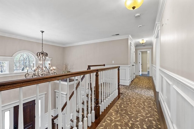 33 Old Concord Rd, Lincoln, MA 01773 - corridor with crown molding, a chandelier, visible vents, and a decorative wall