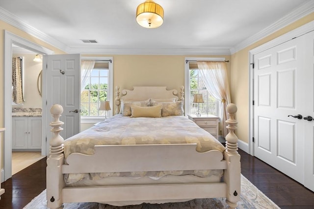 33 Old Concord Rd, Lincoln, MA 01773 - bedroom with multiple windows, dark wood finished floors, and visible vents