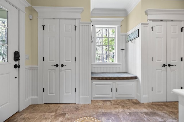 33 Old Concord Rd, Lincoln, MA 01773 - mudroom featuring wainscoting, ornamental molding, and a decorative wall