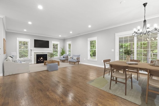 15 Village Ln Unit 15, Wayland, MA 01778 - dining space featuring ornamental molding, a chandelier, a lit fireplace, plenty of natural light, and recessed lighting