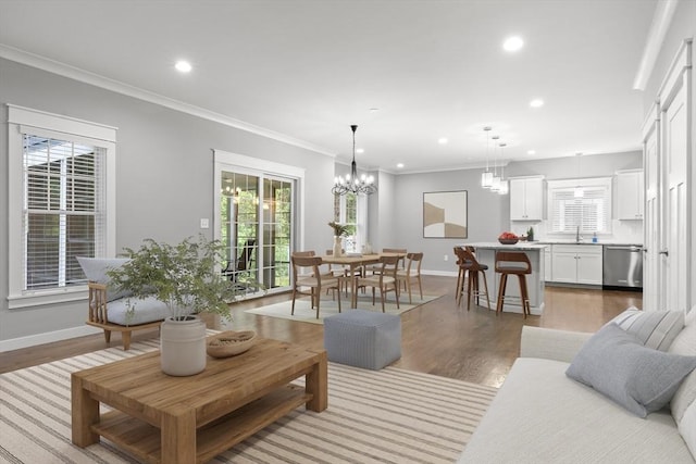 15 Village Ln Unit 15, Wayland, MA 01778 - living room with recessed lighting, light wood finished floors, crown molding, and a chandelier