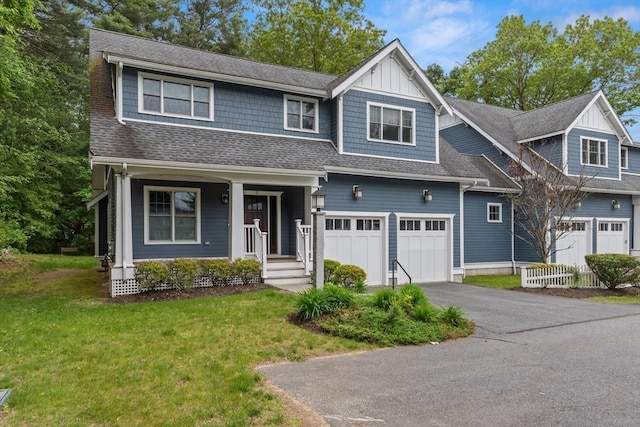 15 Village Ln Unit 15, Wayland, MA 01778 - view of front of home with a front yard, asphalt driveway, covered porch, and roof with shingles