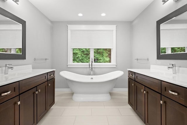 15 Village Ln Unit 15, Wayland, MA 01778 - full bath featuring two vanities, a freestanding tub, recessed lighting, and tile patterned floors