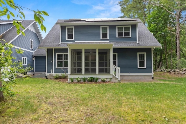 15 Village Ln Unit 15, Wayland, MA 01778 - rear view of property with a lawn, a sunroom, roof with shingles, and roof mounted solar panels