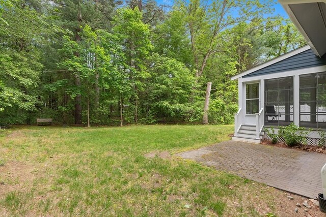 15 Village Ln Unit 15, Wayland, MA 01778 - view of grassy yard featuring a sunroom and a patio