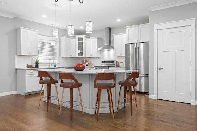 15 Village Ln Unit 15, Wayland, MA 01778 - kitchen with high end fridge, wall chimney range hood, stove, a kitchen island, and recessed lighting