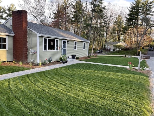 view of front of property with a front lawn