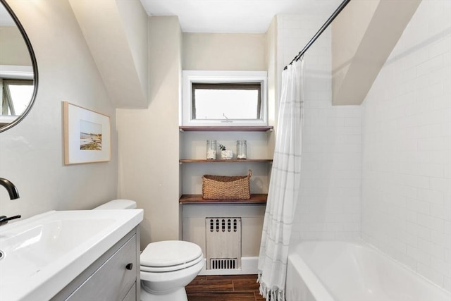 full bathroom featuring shower / tub combo, radiator, toilet, wood finished floors, and vanity