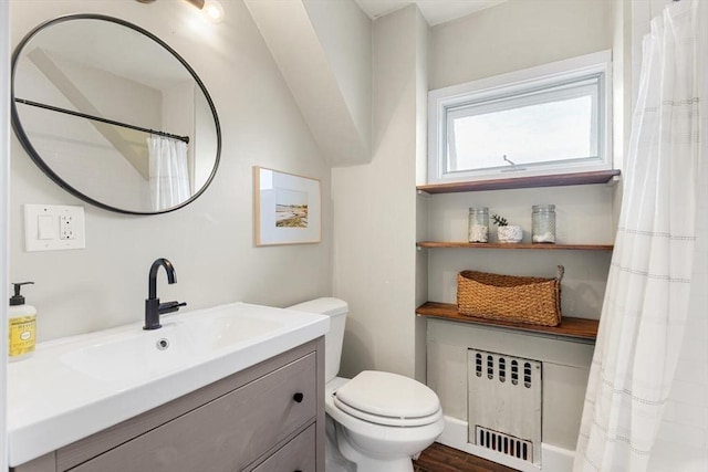 full bath with radiator, toilet, a shower with shower curtain, and vanity