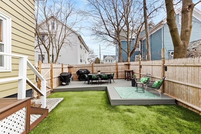 view of yard featuring a deck and a fenced backyard