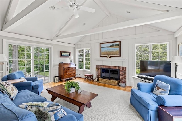 kitchen with stainless steel appliances, blue cabinetry, a kitchen island, and island range hood