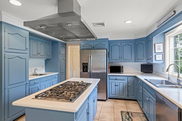 kitchen with island exhaust hood, blue cabinetry, appliances with stainless steel finishes, sink, and a center island