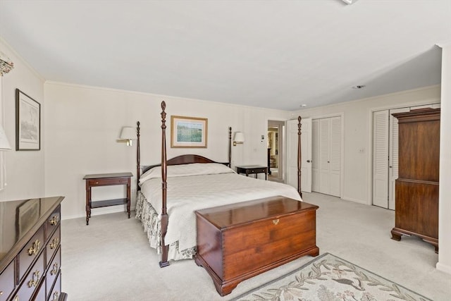 bathroom featuring tile patterned floors, double vanity, crown molding, and radiator