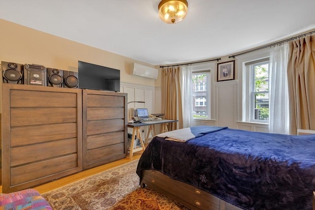 8 Colbourne Cres Unit 1, Brookline, MA 02445 - bedroom with a wall mounted AC and wood finished floors