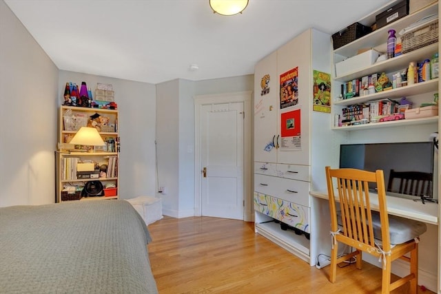 8 Colbourne Cres Unit 1, Brookline, MA 02445 - bedroom with light wood-type flooring and an office area