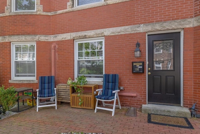 8 Colbourne Cres Unit 1, Brookline, MA 02445 - doorway to property with brick siding