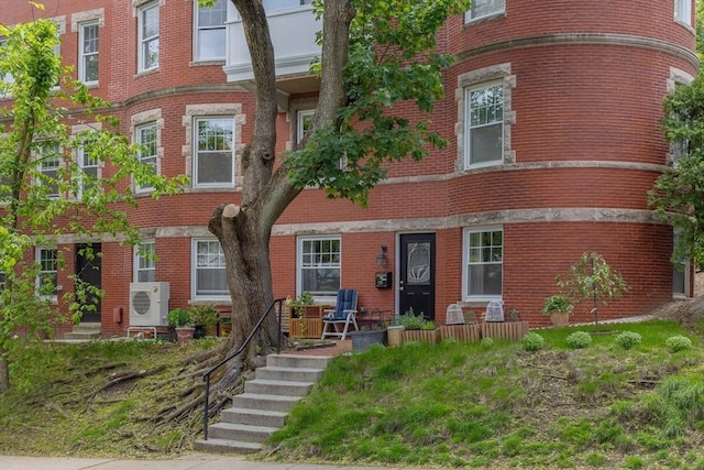 8 Colbourne Cres Unit 1, Brookline, MA 02445 - view of front of house with brick siding and a cooling unit