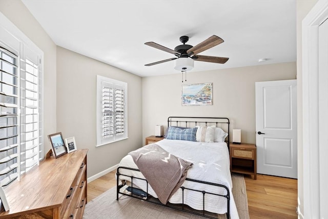 bedroom featuring light hardwood / wood-style flooring and ceiling fan