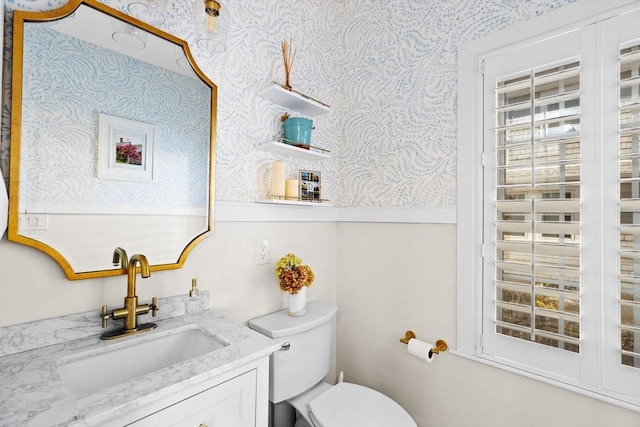 bathroom with vanity and toilet