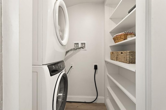 870 S S Unit 3, Boston, MA 02131 - laundry area with stacked washer / drying machine, baseboards, and wood finished floors