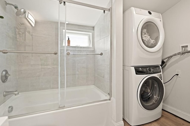 870 S S Unit 3, Boston, MA 02131 - full bathroom with estacked washer and dryer, bath / shower combo with glass door, and wood finished floors