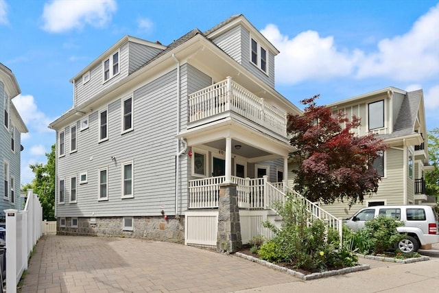 870 S S Unit 3, Boston, MA 02131 - view of side of home featuring a balcony, covered porch, and stairway