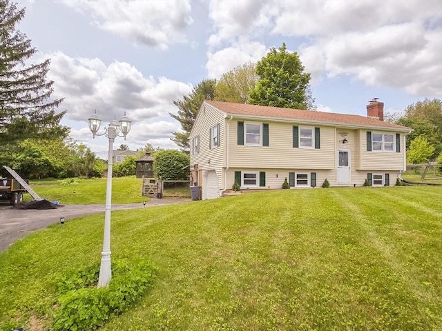 264 Dresser Hill Rd, Dudley, MA 01571 - bi-level home featuring a chimney, an attached garage, a front lawn, and driveway