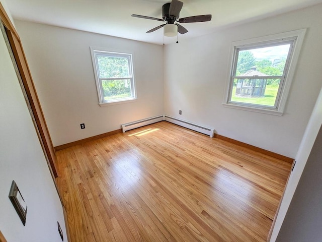 264 Dresser Hill Rd, Dudley, MA 01571 - unfurnished bedroom featuring baseboard heating, light wood-style flooring, baseboards, and ceiling fan