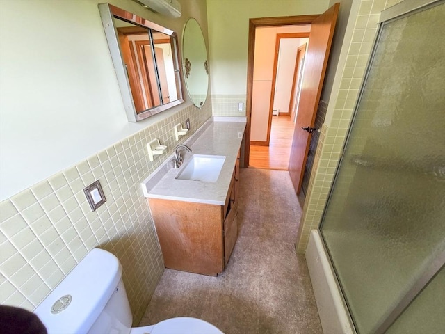 264 Dresser Hill Rd, Dudley, MA 01571 - full bath with tile walls, toilet, vanity, a shower with door, and a wainscoted wall