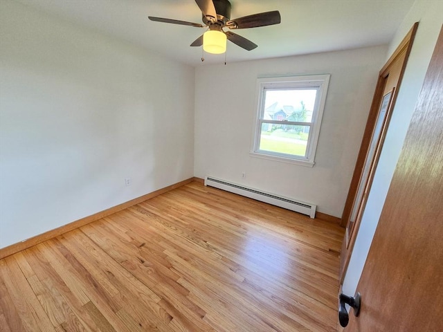 264 Dresser Hill Rd, Dudley, MA 01571 - unfurnished bedroom with baseboard heating, light wood-style floors, baseboards, and ceiling fan